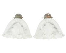 A pair of Holophane glass pendant lights.