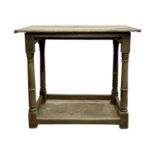 A 17th century oak side table.