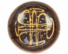 An English slipware pottery colander or strainer dish.