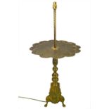 A brass side table with integrated lamp.