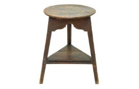 An ash and elm circular cricket table.