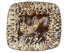 An English slipware pottery dish, dated 1791.
