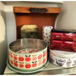 A Le Creuset rack and tins