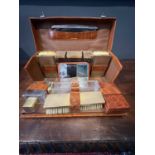 An Asprey crocodile cased silver gilt mounted gentleman's dressing set.