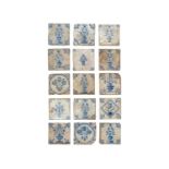 A collection of floral Delft tiles.