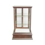 An early 20th century small glazed table top display cabinet for 'Cadbury's Chocolate'