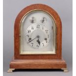 The Junghans Clock Company, a chiming bracket clock with 15cm arched silvered dial, silvered chapter