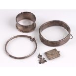 Two engraved silver bangles, a silver napkin ring, a silver stamp case and a 1981 Royal Wedding