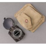 A Second World War German Wehrmacht marching compass (missing mirror to interior), contained in a