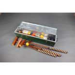 A croquet set comprising 4 mallets, pin, 4 hoops and 4 balls, contained in a metal trunk