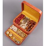 A leather jewellery box containing a collection of costume jewellery - large amber coloured
