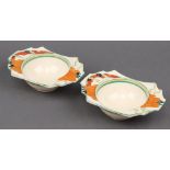 A pair of Clarice Cliff Art Deco daffodil shaped pottery bowls 17cm (both ring flat)