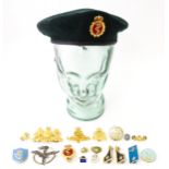 Militaria : a quantity of military insignia, to include a beret with affixed Canadian Armed Forces