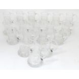A collection of commemorative glass tankards by Dartington Crystal. Approx. 5" high (18) Please Note