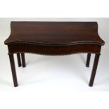 An 18thC Chippendale period mahogany tea table with a serpentine shaped front with carved mouldings.