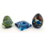 Three Mdina glass items comprising a dump paperweight with chevron detail, a Tiger pattern
