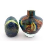 A Mdina glass paperweight signed under. Together with a Mdina glass Tiger pattern vase, Unsigned.