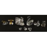 Nine Swarovski crystal models to include swans, telephone, bells, cat, chicks, etc. Largest