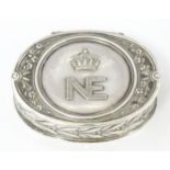 A French silver pill / small snuff box of oval form the hinged lid with NE cipher surmounted by a