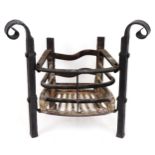 A wrought iron Arts and Crafts style fire grate, approx 24 1/2" wide x 25" high x 16 1/2" deep