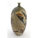A Spanish studio pottery vase by Manuel Millet Lopez decorated with fish and geometric shapes.