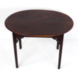 A 19thC side table with an oval top above four chamfered legs with Chinese Chippendale style pierced