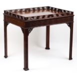 A 19thC Chinese Chippendale style silver table with a pierced upstand, blind fretwork carved