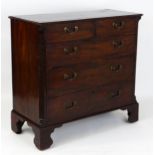 A Georgian mahogany Chippendale style chest of drawers with two short over three long drawers with