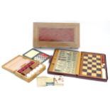 A Backgammon game box. Together with Lecardo, Lexicon and Ukiyo-E card games, a travel chess set and