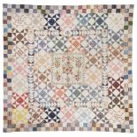 Quilt. A large embroidered patchwork coverlet, early 19th century