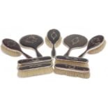 A GEORGE V SILVER AND TORTOISESHELL BACK DRESSING TABLE SERVICE