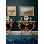 A PAIR OF GILTWOOD AND MARBLE TOPPED ROCOCO CONSOLE TABLES