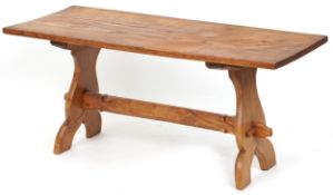 A 20th century elm rectangular coffee table by Jack Grimble, Cromer, raised on shaped supports, 48cm