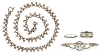 Silver jewellery comprising a Past Times Celtic design bangle, two eternity rings and a Middle