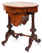 A Victorian walnut work table, the shaped top above a drawer and a well, raised on scroll legs, 72cm