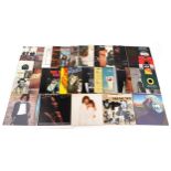 A collection of vinyl LP records including Barbra Streisand Guilty, The Police Outlandos d'Amour,