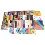 A collection of vinyl LP records including The Isley Brothers Showdown, The Manhattan Transfer