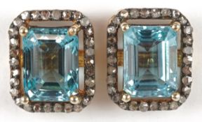 A pair of silver gilt topaz and diamond stud earrings, total diamond weight approximately 0.40