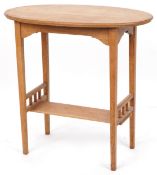 An early 20th century oak oval side table fitted with an under tier, 73cm H x 77cm W x 44cm D.