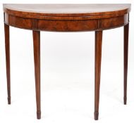 A late George III mahogany demi lune fold over card table raised on square tapering legs, 73cm H x