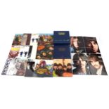 A small collection of vinyl LP records by The Beatles including Help, Sgt. Pepper's Lonely Hearts