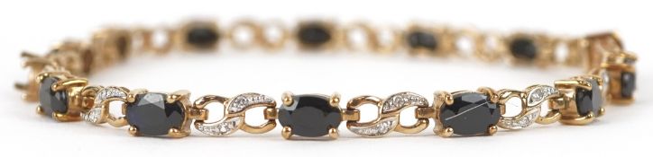 A 9ct gold diamond and blue spinel bracelet, 20.5cm in length, 8.3g.