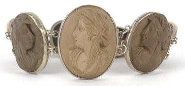 An antique white metal lava cameo bracelet carved with maiden heads, 16cm in length, 30.7g.