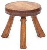 A 20th century elm staked milking stool by Jack Grimble, Cromer, the circular seat raised on