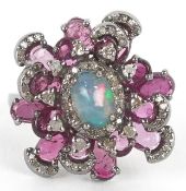 A silver cabochon opal pink tourmaline and diamond cluster ring, total diamond weight 0.40 carat,