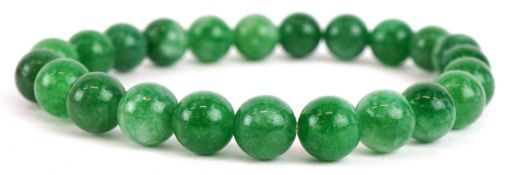 A Chinese green stone bracelet, tests as jade, each bead approximately 8.4mm in diameter, total