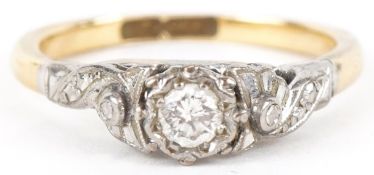 An 18ct gold and platinum diamond solitaire ring, the diamond approximately 3.10mm in diameter, size