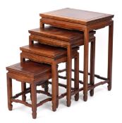 A Chinese hardwood quartetto nest of occasional tables, 20th century, raised on block legs, 65cm H x