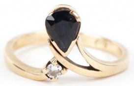 A 9ct gold sapphire and diamond wishbone ring, size N, 2.5g.
