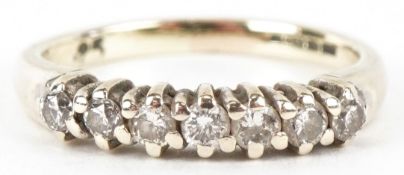 A 9ct gold diamond half eternity ring, total diamond weight approximately 0.25 carat, size G, 1.7g.